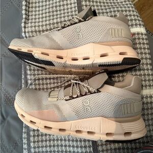 On Running Cream and Pink Sneakers